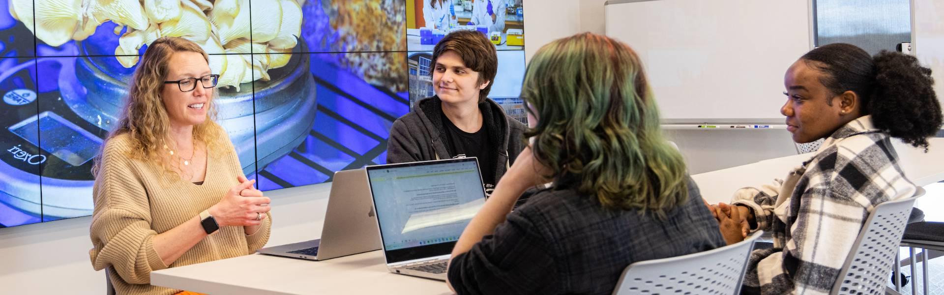 research students talking with research mentor